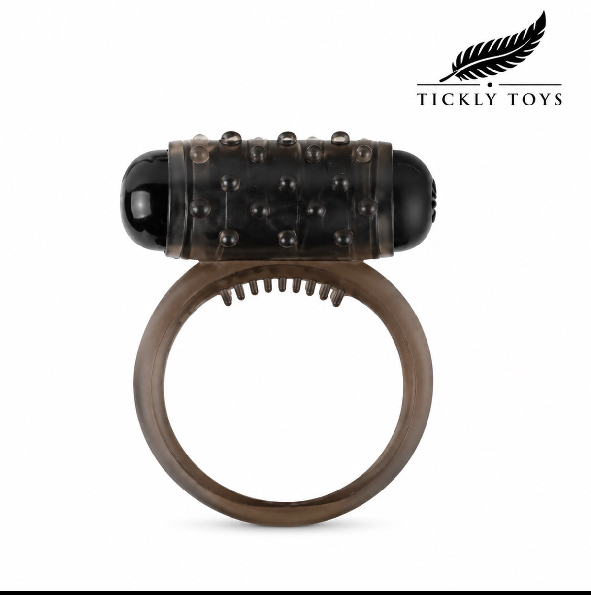 An adult novelty device featuring a translucent dark brown silicone ring with a textured black studded cylinder on top, shown against a plain white background with the Tickly Toys brand logo in the top right corner.