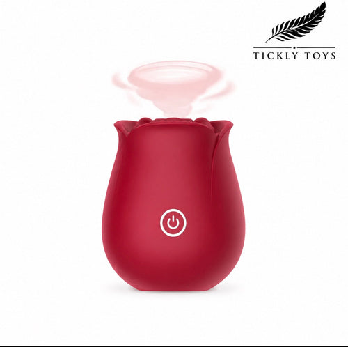A red rose-shaped personal massager or humidifier by Tickly Toys, shown on a white background with a soft pink mist graphic above it and the Tickly Toys brand logo in the top right corner.