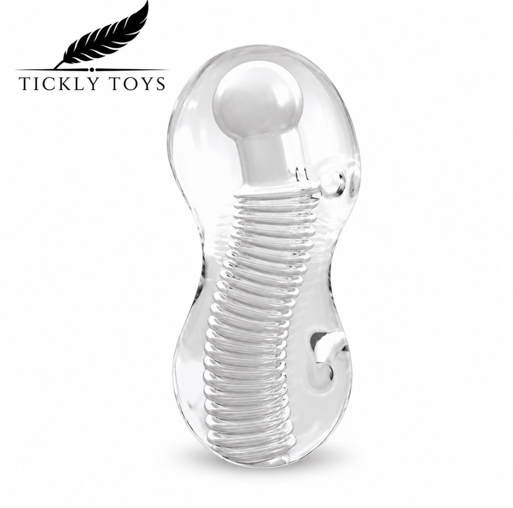 Clear transparent silicone adult novelty toy with a coiled spring design and rounded head, shown on a white background with the Tickly Toys logo in the top left.