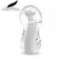 Clear transparent silicone adult novelty toy with a coiled spring design and rounded head, shown on a white background with the Tickly Toys logo in the top left.