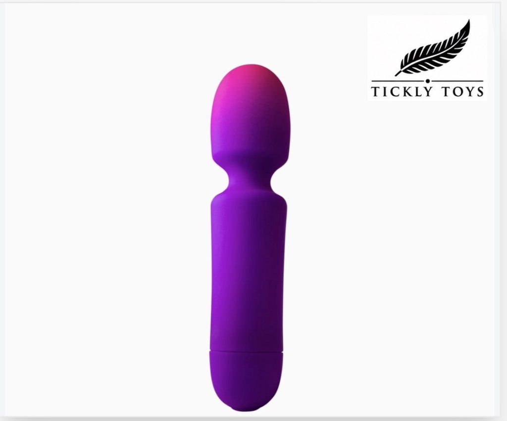 A purple and magenta gradient silicone personal massager by Tickly Toys, shown vertically against a white background with the Tickly Toys brand logo in the top right corner.